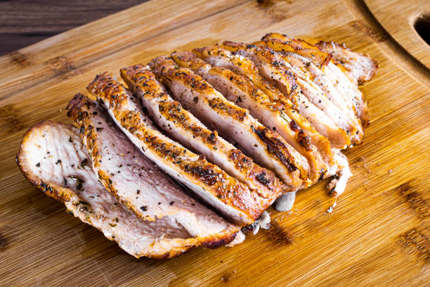 istock Pork steak roasted on a wooden board and sliced 1471752924