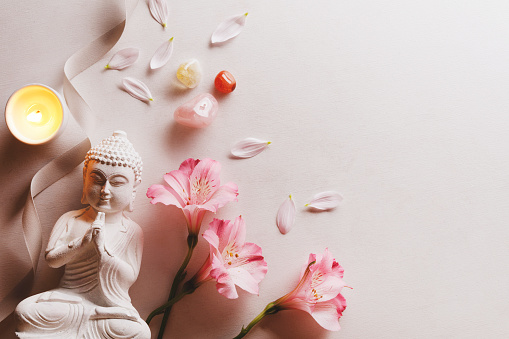 Buddha statue with lily and minerals