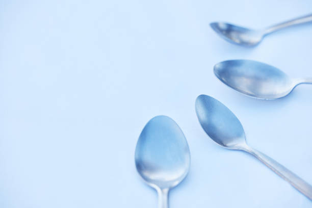 istock Kitchen, cutlery and spoon on a table as a group with mockup to represent community, charity or donation. Cooking, metal and space with steel utensils on a surface from above to volunteer or donate 1471773944