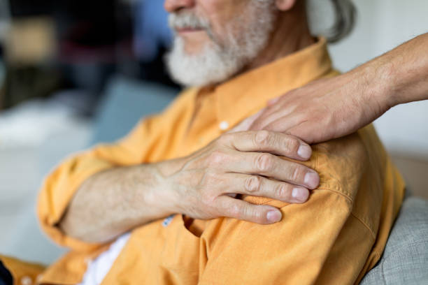 istock Unrecognizable son and his senior father at home, copy space 1471775245