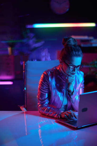 istock pensive elegant business woman in glasses using laptop 1471777643
