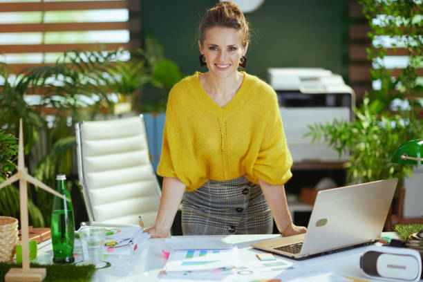 istock business owner woman in green office working with documents 1471778168