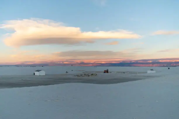 White Sands National Park Beautiful Sunset with Clouds and Grass and Buildings and FORD pickup truck
