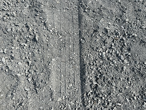close up wheel track on stone road