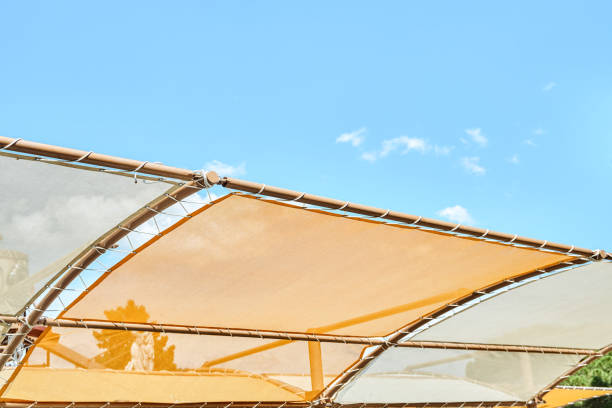 istock Orange canopy over sun loungers against clear blue sky 1471794668