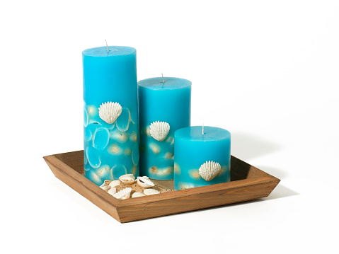 Decorative candles on white background