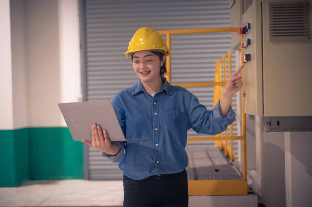 istock Asian woman Engineer using computer working in factory 1471798496