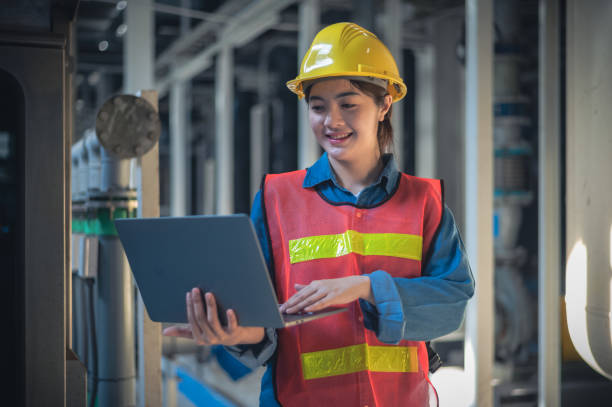 istock Asian woman Engineer using computer working in factory 1471798504