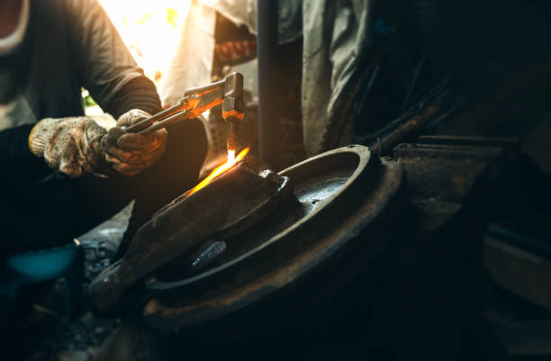 istock Close up hand heavy industrial worker is working on metal work factory process by Cutting sheet steel with gas cutting machine cutting thick steel. 1471806210