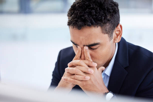 istock Stress headache, burnout and man in office overwhelmed with workload at computer. Mental health, frustrated and overworked tired trader at startup, anxiety from deadline time in stock market crisis. 1471806249