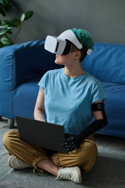 istock Woman playing in virtual reality game 1471808744