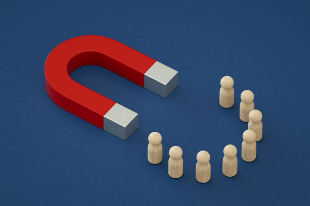 istock Magnet with group of pawn people 1471809511
