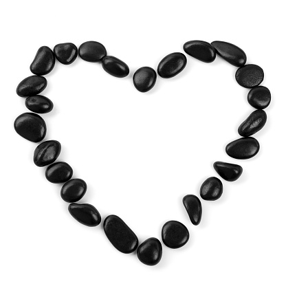 black stones heart isolated on the white background.