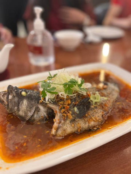 istock Fish dishes with broth served on a concave square plate 1471811919