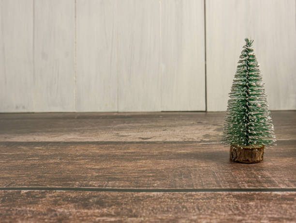 istock Christmas tree miniature on wood table for holiday concept 1471812314