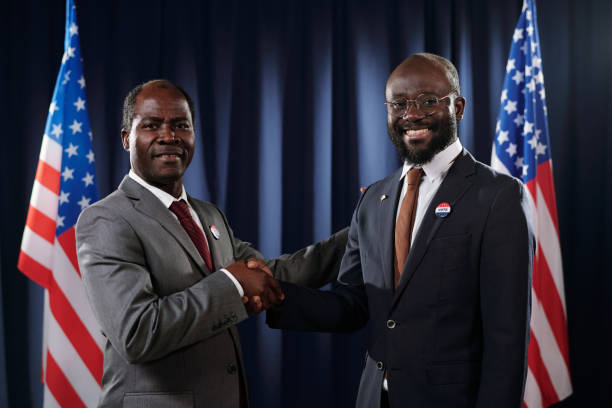 istock Two successful political leaders in formalwear shaking hands 1471814576