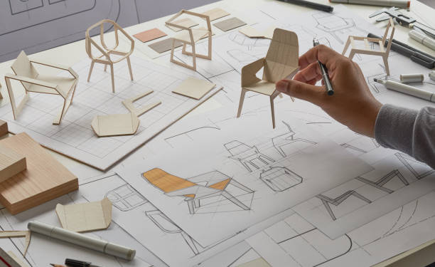 istock Designer sketching drawing design development product plan draft chair armchair Wingback Interior furniture prototype manufacturing production. designer studio concept . 1471817705