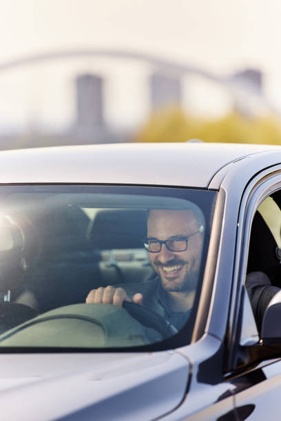 istock Happy businessman going on a trip by car. 1471821007