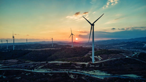 Free Stock Photo of Sunset over rolling hills with wind turbines ...