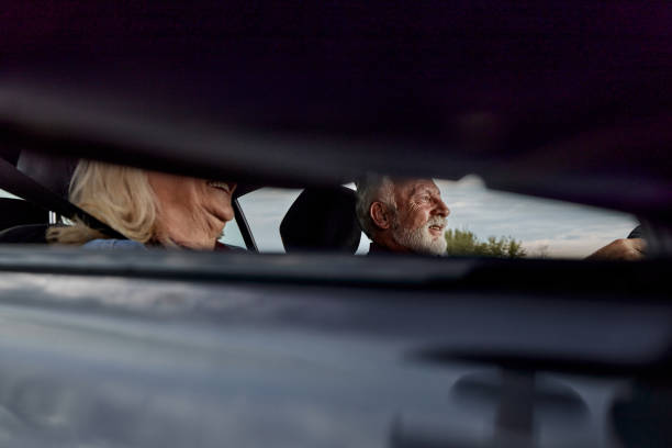 istock Happy senior couple going on a trip by car. 1471821138