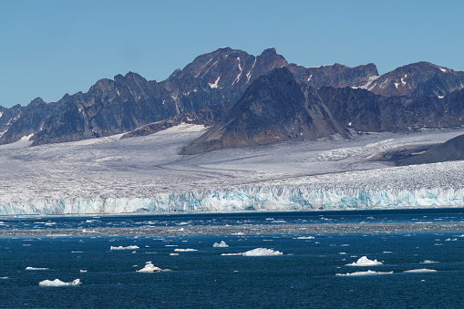 a glacier calves on the island of Spitzbergen, Svalbard