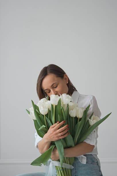 istock Woman with tulip flowers 1471822280
