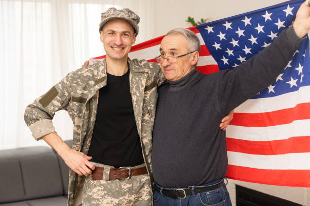 istock an elderly father and a military son, American flag 1471823305