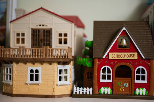 Miniature toys family with father,mother, son and miniature house.