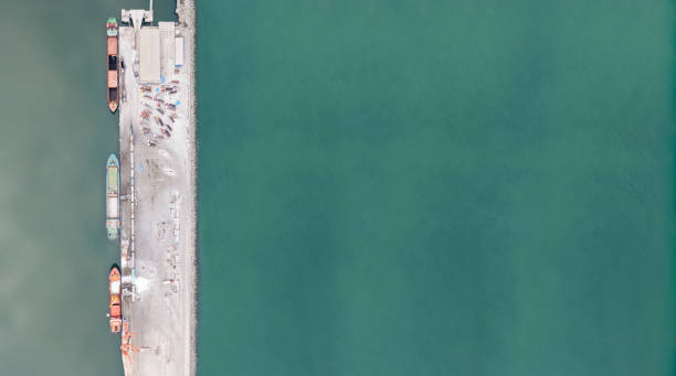 istock Loading trucks in commercial port. 1471823850