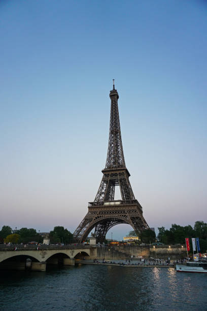 istock Exterior architecture and design of Eiffel wrought iron lattice tower with clear blue sky- Paris, France 1471825741