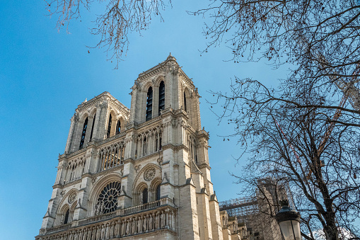 The facade is 41 metres wide and includes four powerful buttresses and three portals. The West Facade of Notre-Dame cathedral took less than a century to be built. Construction started in 1200 under the direction of Paris' bishop Eudes de Sully.