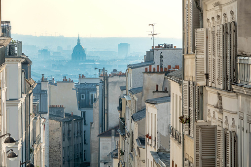 View of Paris and the Dome des Invalides, as seen from Montmartre (Paris, France), late in the afternoon