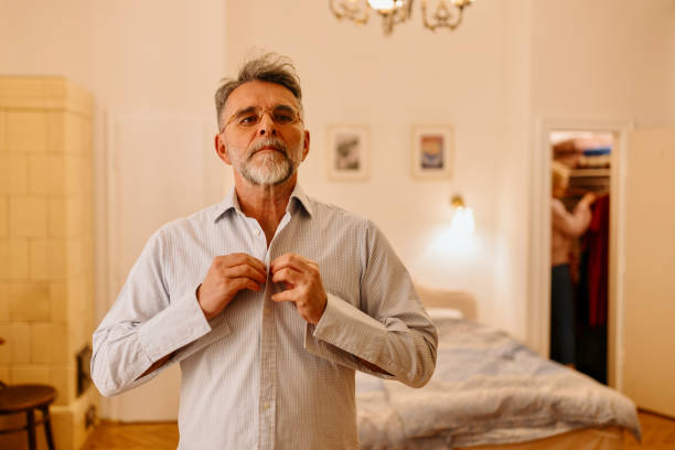 istock Mature man preparing to go out 1471836666