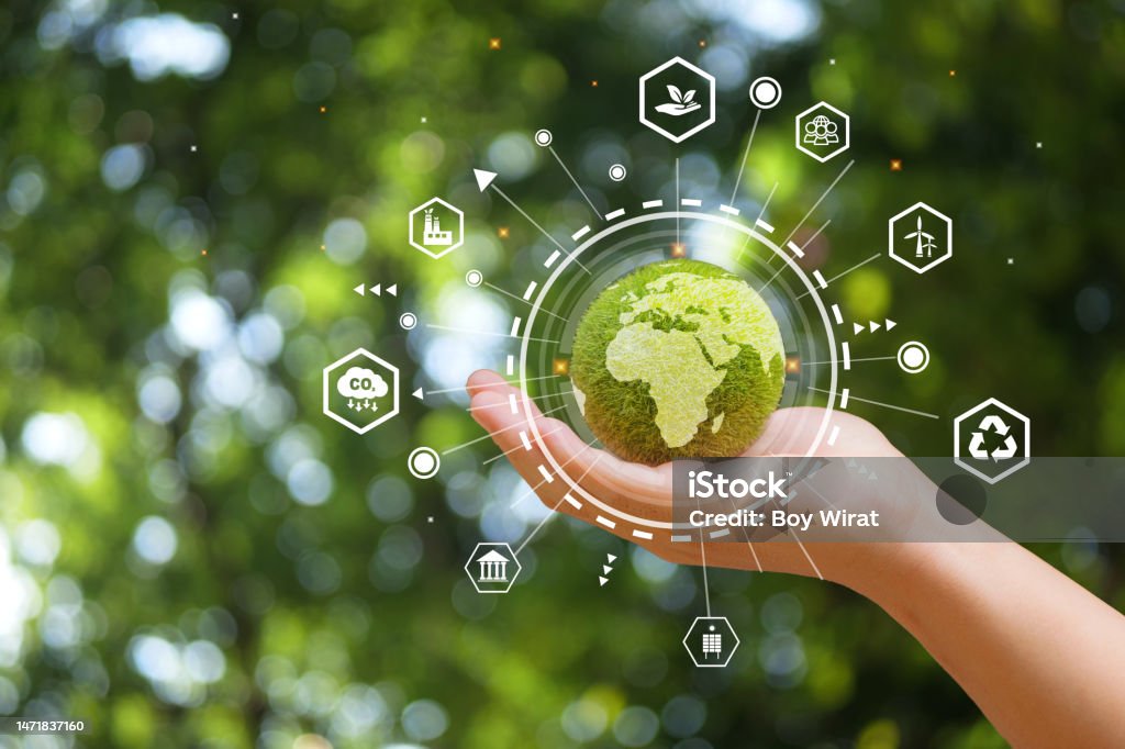 Hand of human holding green earth with the icon of Environment for ESG, co2,  and net zero.World sustainable environment concept. Sustainable Resources Stock Photo