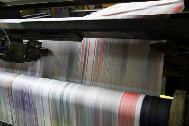 istock Newspaper folding machine in a printing plant 1471838101