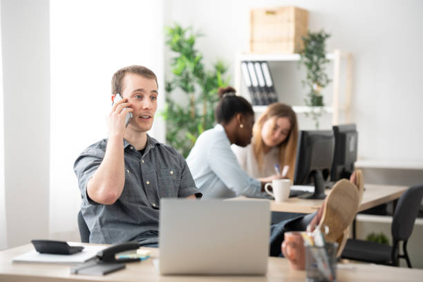 istock Carefree office worker talking on phone 1471838296