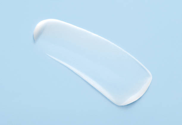 istock cosmetic smears cream texture on pastel blue background 1471842443