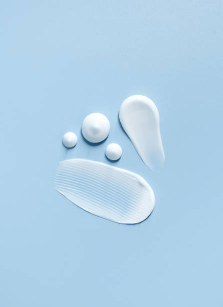 istock cosmetic smears cream texture on pastel blue background 1471842444
