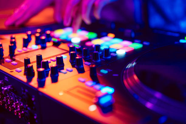 Close up of DJ hands on dj console mixer during concert in the club Close up of DJ hands on dj console mixer during concert in the night club dj stock pictures, royalty-free photos & images