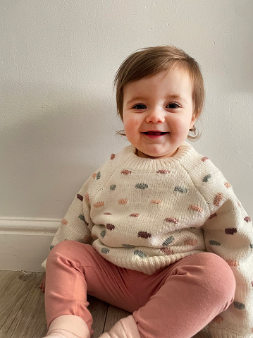 One year old girl in wool sweater