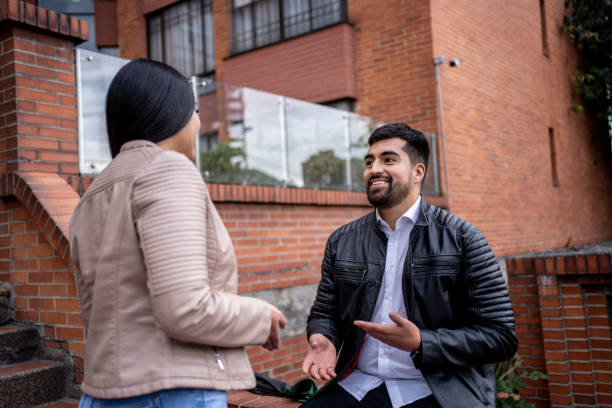 istock Young man talking with his girlfriend outdoors 1471849283