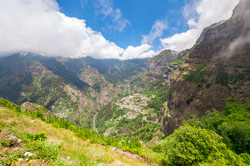Miradouro do Curral das Freiras viewpoint with a spectaculair over the Valley of the Nuns on Madeira island, Portugal during a beautiful summer day.