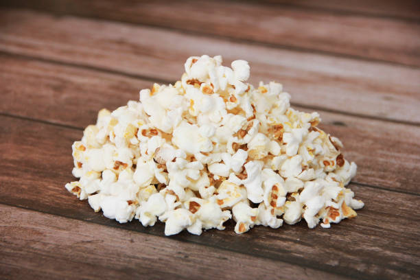 istock White fried dry popcorn on a wooden brown background 1471850677
