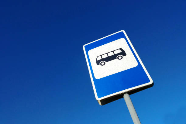 istock Bus stop sign on blue sky background close-up 1471853326