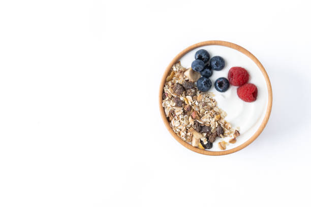 istock Yogurt with berries and muesli for breakfast in bowl isolated on white background 1471855183