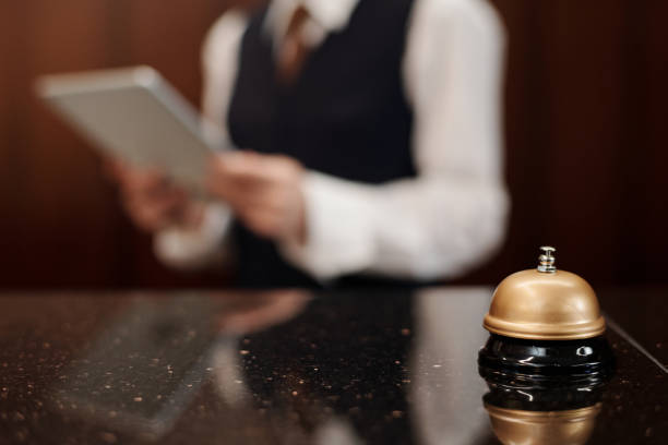 istock Selective focus on bell and reception counter against female manager 1471856014