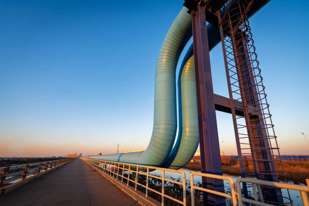 istock Blue pipes going to oil refinery at sunset 1471856751