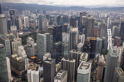 Hong Kong aerial view with urban skyscrapers boat and sea