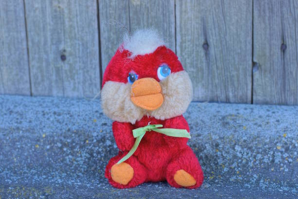 istock one small red toy duck made of cloth 1471858708