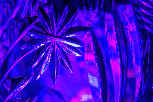 Abstract background. Shot of an illuminated embossed glass surface.